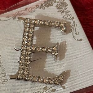 Elegant rhinestone letter “E” brooch Silver tone